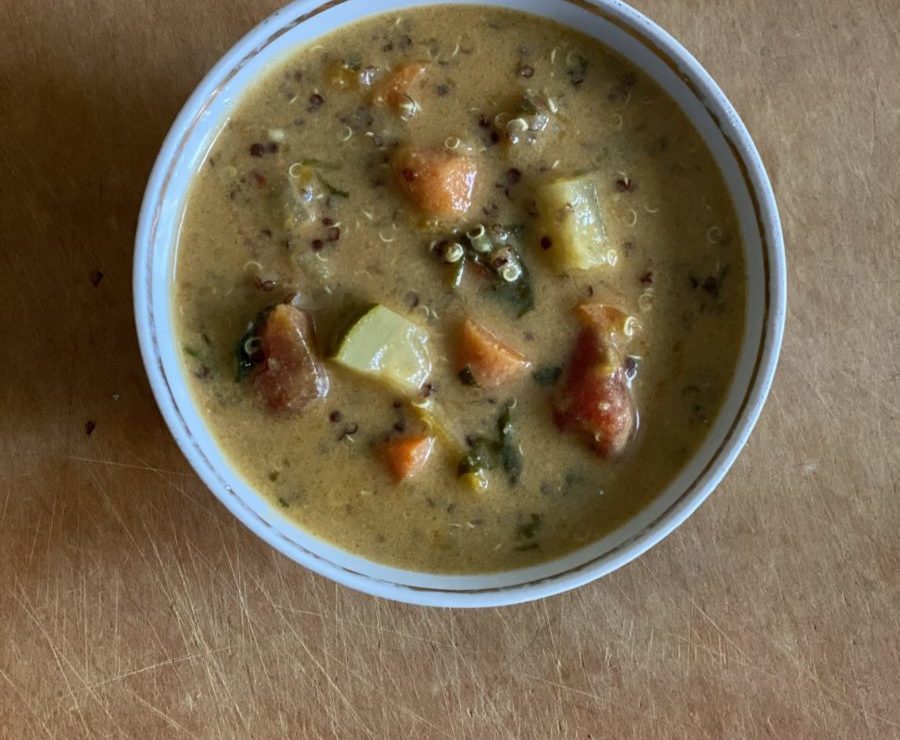 A small bowl of creamy peanut vegetable soup